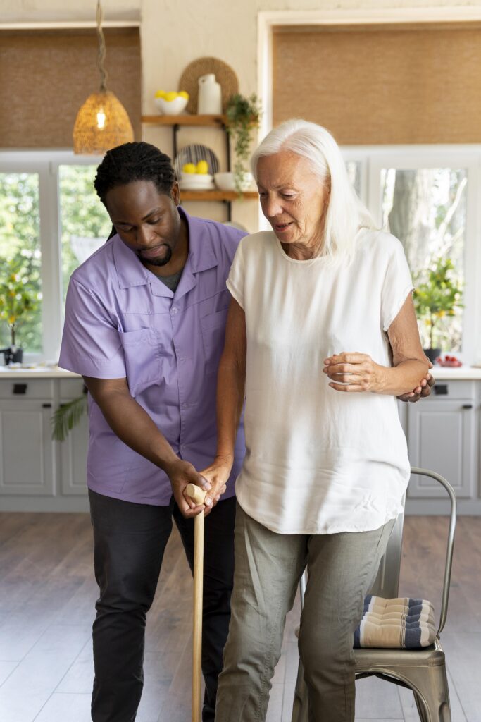 male social worker taking care old woman scaled